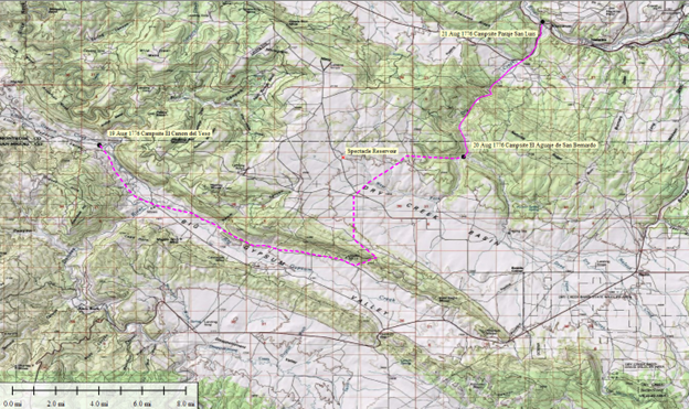 A topographic map with a pink route highlighted through varied terrain, labeled with specific locations and a scale bar showing distances from 0 to 8 kilometers.