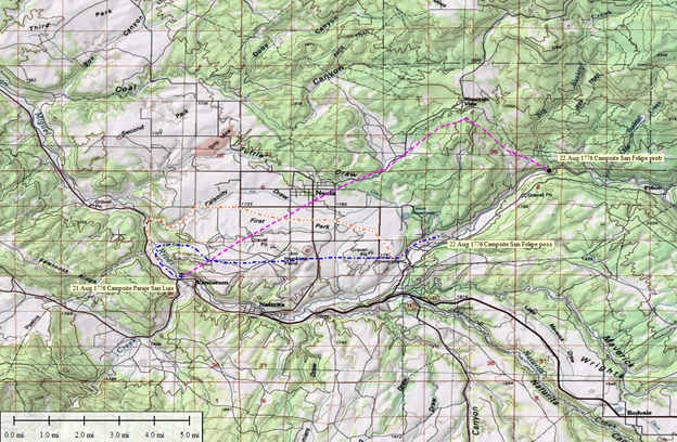 Topographic map with three colored routes and a distance scale.